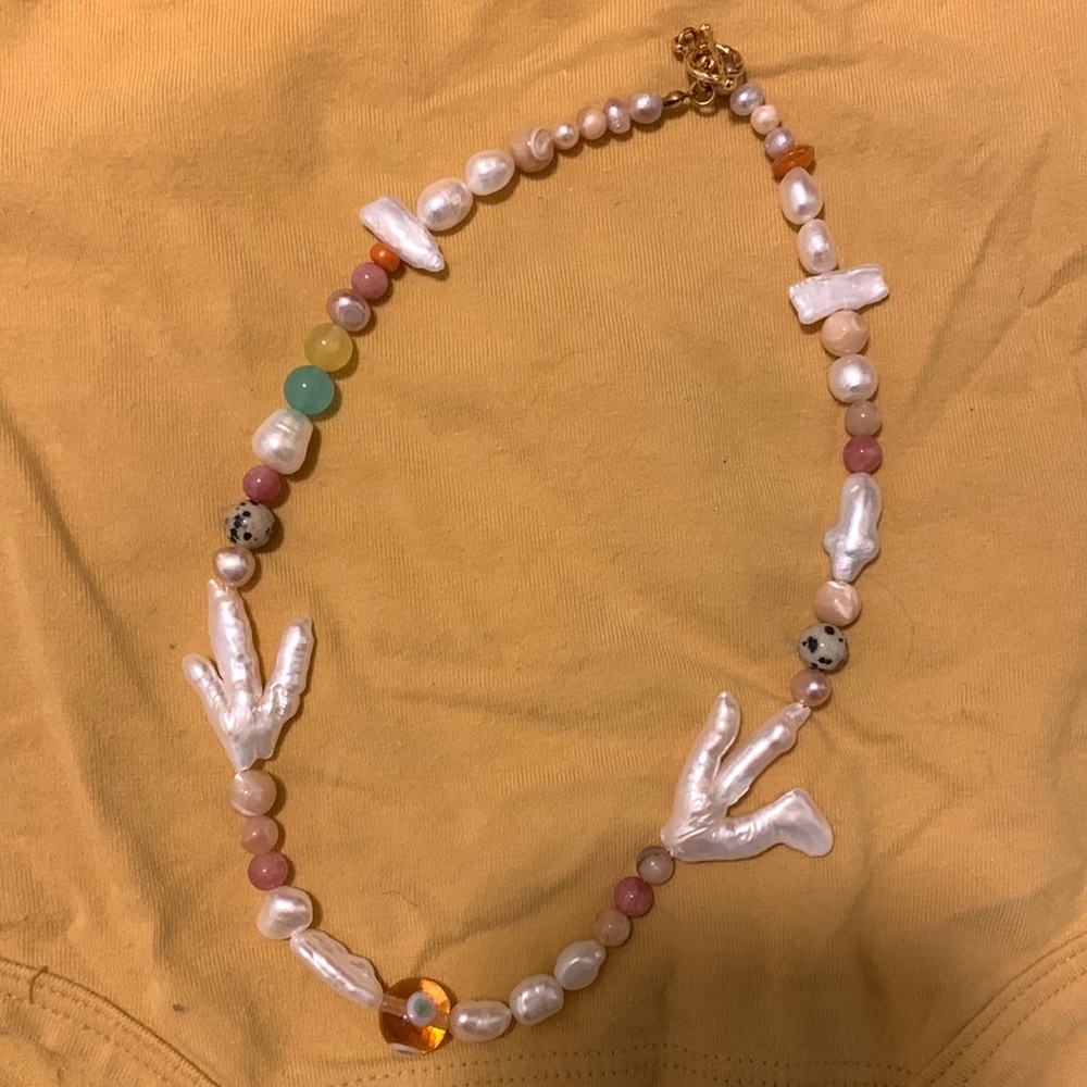 Beautiful hand crafted soft pink and mother of pearl necklace.